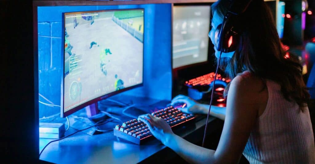 Woman Playing A Game On A Computer