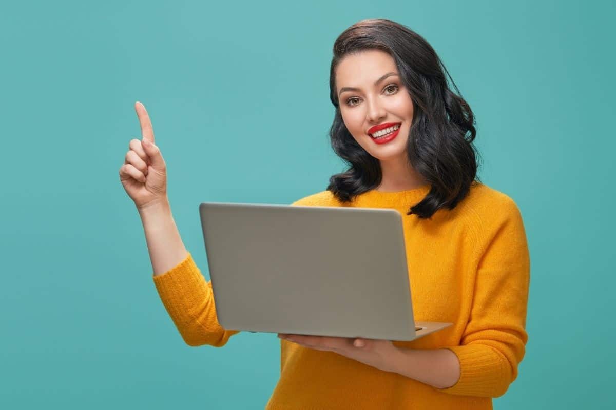 Happy Woman Using Laptop