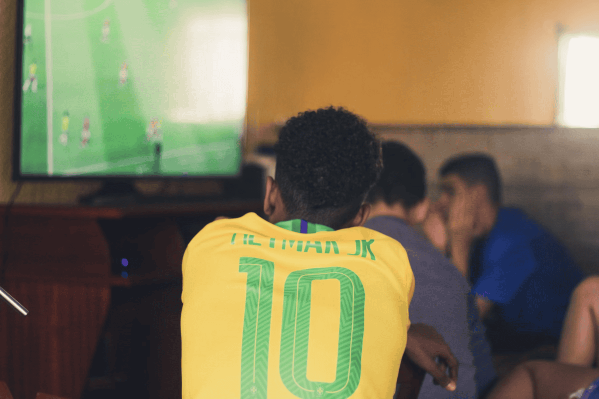 Man Watching Soccer With A Brazil Jersey